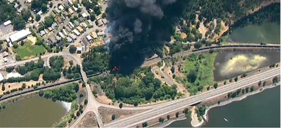 Above: Fire after derailment of a Union Pacific train carrying oil, next to Interstate 84 and the Columbia River in the small city of Mosier, Oregon, June 3, 2016. (Photo KGW TV.)